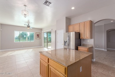 Gated community living at its best! This 4-bedroom, 2-bath home on Palm Valley Golf Club  in Arizona - for sale on GolfHomes.com, golf home, golf lot