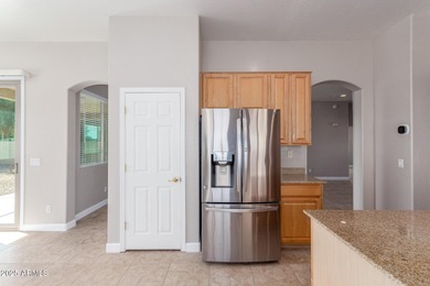 Gated community living at its best! This 4-bedroom, 2-bath home on Palm Valley Golf Club  in Arizona - for sale on GolfHomes.com, golf home, golf lot