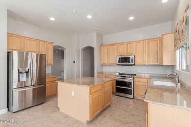 Gated community living at its best! This 4-bedroom, 2-bath home on Palm Valley Golf Club  in Arizona - for sale on GolfHomes.com, golf home, golf lot