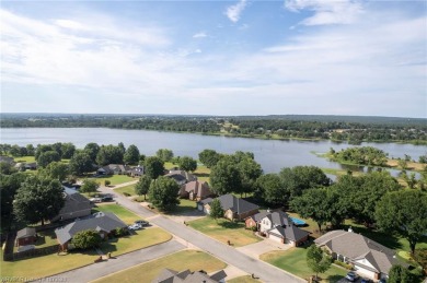 Enjoy this lakefront home in all seasons! Fish off the dock and on Vache-Grasse Country Club in Arkansas - for sale on GolfHomes.com, golf home, golf lot