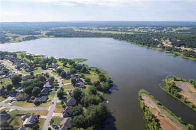 Enjoy this lakefront home in all seasons! Fish off the dock and on Vache-Grasse Country Club in Arkansas - for sale on GolfHomes.com, golf home, golf lot