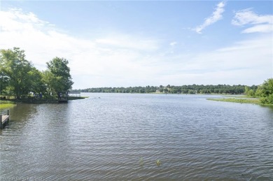 Enjoy this lakefront home in all seasons! Fish off the dock and on Vache-Grasse Country Club in Arkansas - for sale on GolfHomes.com, golf home, golf lot