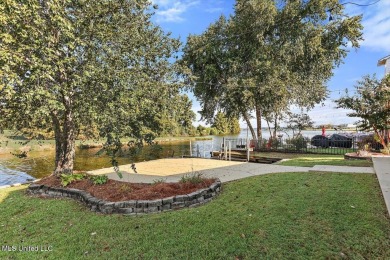 This stunning waterfront property at Lake Caroline is a rare on Lake Caroline Golf Club in Mississippi - for sale on GolfHomes.com, golf home, golf lot