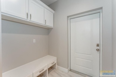 Experience elevated living in this exquisite 3 bed, 2 bath home on South Padre Island Golf Club in Texas - for sale on GolfHomes.com, golf home, golf lot