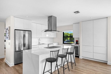 Experience resort-style living in this beautifully renovated on Quail Ridge Golf Course and Country Club in Florida - for sale on GolfHomes.com, golf home, golf lot