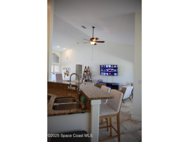 Beautifully maintained 3-bedroom, 2-bathroom pool home located on Suntree Country Club in Florida - for sale on GolfHomes.com, golf home, golf lot