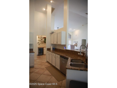 Beautifully maintained 3-bedroom, 2-bathroom pool home located on Suntree Country Club in Florida - for sale on GolfHomes.com, golf home, golf lot