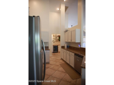 Beautifully maintained 3-bedroom, 2-bathroom pool home located on Suntree Country Club in Florida - for sale on GolfHomes.com, golf home, golf lot