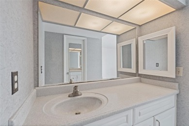This bright and cheerful 2/2 Cove Cay gem is priced to sell! on Cove Cay Country Club in Florida - for sale on GolfHomes.com, golf home, golf lot