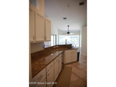 Beautifully maintained 3-bedroom, 2-bathroom pool home located on Suntree Country Club in Florida - for sale on GolfHomes.com, golf home, golf lot