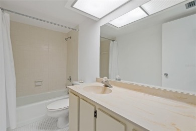 This bright and cheerful 2/2 Cove Cay gem is priced to sell! on Cove Cay Country Club in Florida - for sale on GolfHomes.com, golf home, golf lot