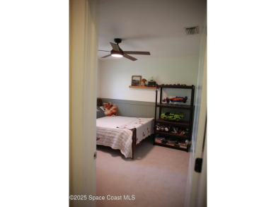 Beautifully maintained 3-bedroom, 2-bathroom pool home located on Suntree Country Club in Florida - for sale on GolfHomes.com, golf home, golf lot