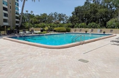This bright and cheerful 2/2 Cove Cay gem is priced to sell! on Cove Cay Country Club in Florida - for sale on GolfHomes.com, golf home, golf lot