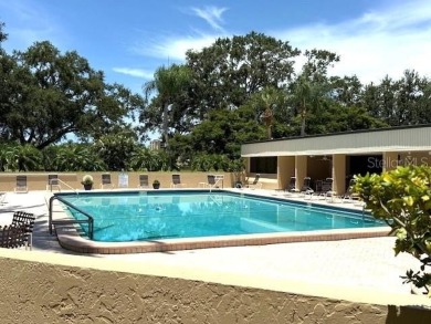 This bright and cheerful 2/2 Cove Cay gem is priced to sell! on Cove Cay Country Club in Florida - for sale on GolfHomes.com, golf home, golf lot