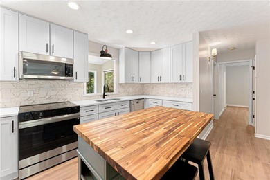 Welcome to this beautifully renovated cedar-sided Cape Cod on The Trail At Chickasaw Pointe in South Carolina - for sale on GolfHomes.com, golf home, golf lot