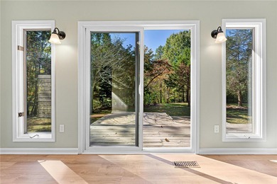 Welcome to this beautifully renovated cedar-sided Cape Cod on The Trail At Chickasaw Pointe in South Carolina - for sale on GolfHomes.com, golf home, golf lot