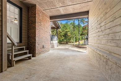 Welcome to this beautifully renovated cedar-sided Cape Cod on The Trail At Chickasaw Pointe in South Carolina - for sale on GolfHomes.com, golf home, golf lot