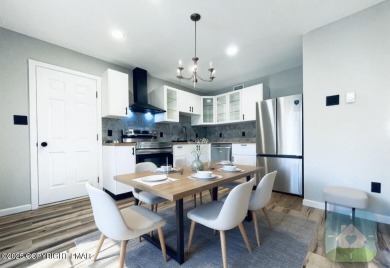 This MODERN, FULLY RENOVATED Colonial-Style Home with three on Pocono Farms Country Club in Pennsylvania - for sale on GolfHomes.com, golf home, golf lot
