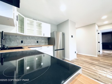 This MODERN, FULLY RENOVATED Colonial-Style Home with three on Pocono Farms Country Club in Pennsylvania - for sale on GolfHomes.com, golf home, golf lot