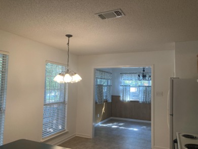 This one-owner home sits on three wooded lots for a total of .75 on Holly Lake Ranch Golf Club in Texas - for sale on GolfHomes.com, golf home, golf lot