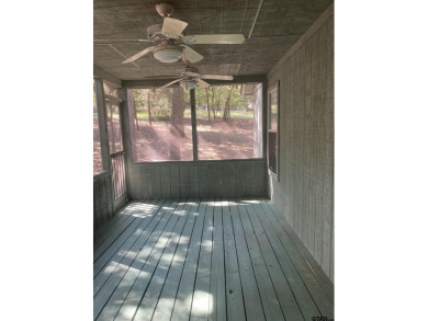 This one-owner home sits on three wooded lots for a total of .75 on Holly Lake Ranch Golf Club in Texas - for sale on GolfHomes.com, golf home, golf lot