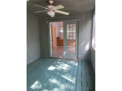 This one-owner home sits on three wooded lots for a total of .75 on Holly Lake Ranch Golf Club in Texas - for sale on GolfHomes.com, golf home, golf lot