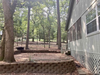 This one-owner home sits on three wooded lots for a total of .75 on Holly Lake Ranch Golf Club in Texas - for sale on GolfHomes.com, golf home, golf lot