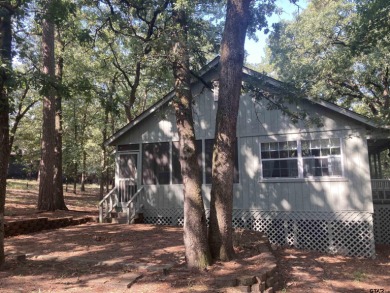 This one-owner home sits on three wooded lots for a total of .75 on Holly Lake Ranch Golf Club in Texas - for sale on GolfHomes.com, golf home, golf lot