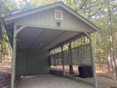 This one-owner home sits on three wooded lots for a total of .75 on Holly Lake Ranch Golf Club in Texas - for sale on GolfHomes.com, golf home, golf lot