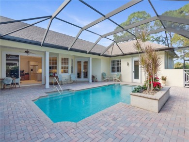 This courtyard pool home is nestled on a lush golf course on Indian River Club in Florida - for sale on GolfHomes.com, golf home, golf lot