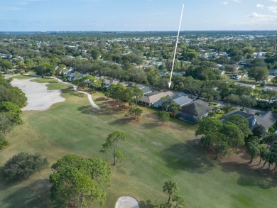 This courtyard pool home is nestled on a lush golf course on Indian River Club in Florida - for sale on GolfHomes.com, golf home, golf lot