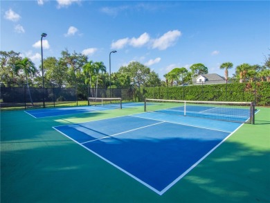 This courtyard pool home is nestled on a lush golf course on Indian River Club in Florida - for sale on GolfHomes.com, golf home, golf lot