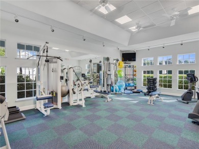 This courtyard pool home is nestled on a lush golf course on Indian River Club in Florida - for sale on GolfHomes.com, golf home, golf lot