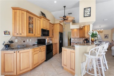 Highly sought-after SW Cape area GULF ACCESS POOL HOME! BOASTS on Royal Tee Country Club in Florida - for sale on GolfHomes.com, golf home, golf lot