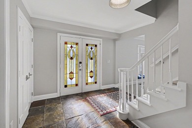 This completely updated Colonial overlooking the #12 Green at on Travis Pointe Country Club in Michigan - for sale on GolfHomes.com, golf home, golf lot