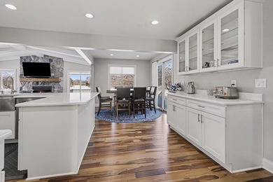 This completely updated Colonial overlooking the #12 Green at on Travis Pointe Country Club in Michigan - for sale on GolfHomes.com, golf home, golf lot