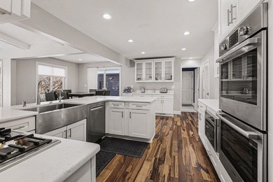 This completely updated Colonial overlooking the #12 Green at on Travis Pointe Country Club in Michigan - for sale on GolfHomes.com, golf home, golf lot