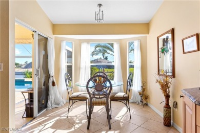 Highly sought-after SW Cape area GULF ACCESS POOL HOME! BOASTS on Royal Tee Country Club in Florida - for sale on GolfHomes.com, golf home, golf lot