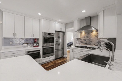 This completely updated Colonial overlooking the #12 Green at on Travis Pointe Country Club in Michigan - for sale on GolfHomes.com, golf home, golf lot