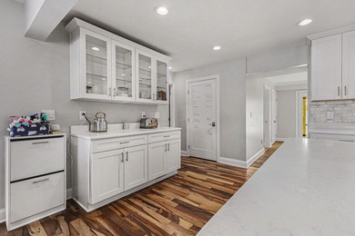 This completely updated Colonial overlooking the #12 Green at on Travis Pointe Country Club in Michigan - for sale on GolfHomes.com, golf home, golf lot