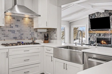 This completely updated Colonial overlooking the #12 Green at on Travis Pointe Country Club in Michigan - for sale on GolfHomes.com, golf home, golf lot