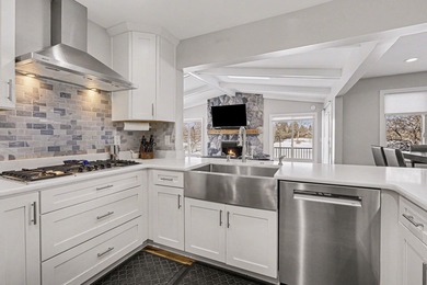 This completely updated Colonial overlooking the #12 Green at on Travis Pointe Country Club in Michigan - for sale on GolfHomes.com, golf home, golf lot