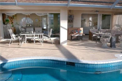Highly sought-after SW Cape area GULF ACCESS POOL HOME! BOASTS on Royal Tee Country Club in Florida - for sale on GolfHomes.com, golf home, golf lot