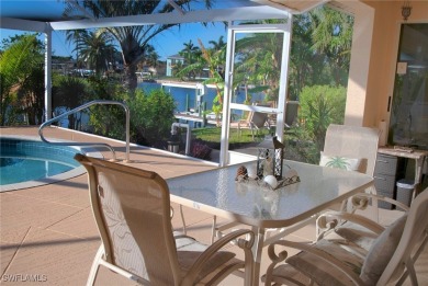 Highly sought-after SW Cape area GULF ACCESS POOL HOME! BOASTS on Royal Tee Country Club in Florida - for sale on GolfHomes.com, golf home, golf lot