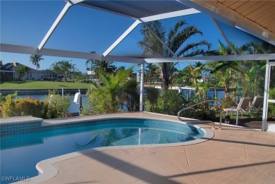 Highly sought-after SW Cape area GULF ACCESS POOL HOME! BOASTS on Royal Tee Country Club in Florida - for sale on GolfHomes.com, golf home, golf lot