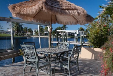 Highly sought-after SW Cape area GULF ACCESS POOL HOME! BOASTS on Royal Tee Country Club in Florida - for sale on GolfHomes.com, golf home, golf lot
