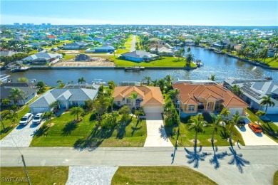 Highly sought-after SW Cape area GULF ACCESS POOL HOME! BOASTS on Royal Tee Country Club in Florida - for sale on GolfHomes.com, golf home, golf lot