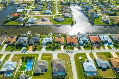 Highly sought-after SW Cape area GULF ACCESS POOL HOME! BOASTS on Royal Tee Country Club in Florida - for sale on GolfHomes.com, golf home, golf lot
