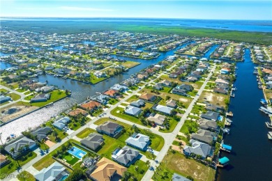 Highly sought-after SW Cape area GULF ACCESS POOL HOME! BOASTS on Royal Tee Country Club in Florida - for sale on GolfHomes.com, golf home, golf lot