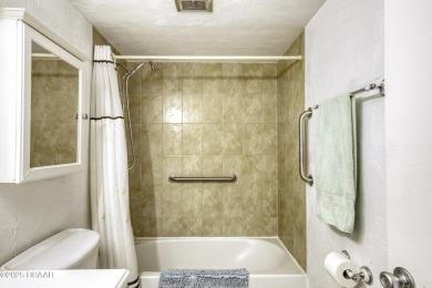 Enjoy easy living in this beautifully furnished 2-bedroom on Daytona Beach Golf Club in Florida - for sale on GolfHomes.com, golf home, golf lot